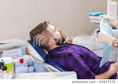 Doctor and patient in the dental clinic. dentistry and dental health concept. 64837578