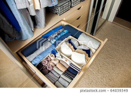 Top view of neatly folded things in grey blue color Top view of neatly folded things in grey blue color 64839349