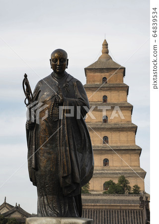 Giant Wild Goose Pagoda and statue of Xuanzang, a seventh-century Buddhist monk, scholar, traveller, and translator , Xi'an, Shaanxi, China 64839534