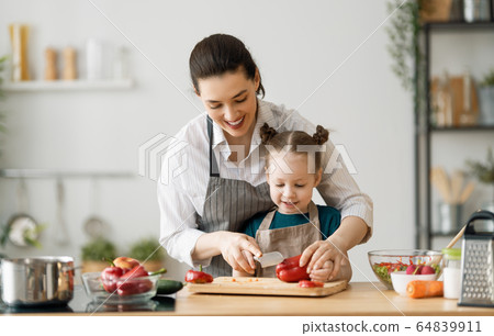 Happy family in the kitchen. Happy family in the kitchen. 64839911