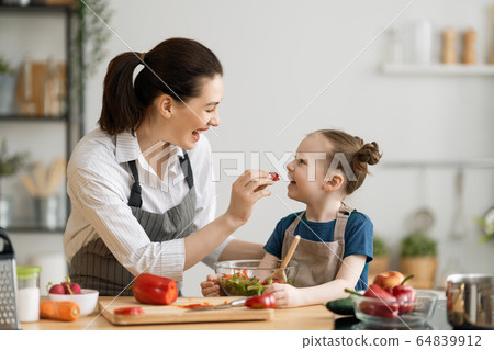 Happy family in the kitchen. Happy family in the kitchen. 64839912
