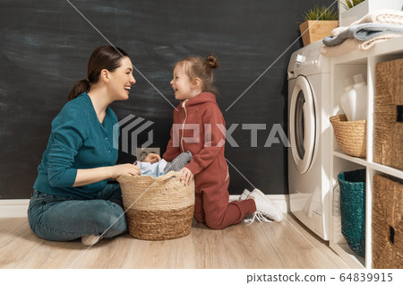 family doing laundry family doing laundry 64839915