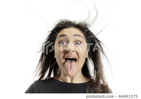 Smiling girl opening her mouth and showing the long big giant tongue isolated on white background, crazy and attracted Smiling girl opening her mouth and showing the long big giant tongue isolated on white background, crazy and attracted 64841575