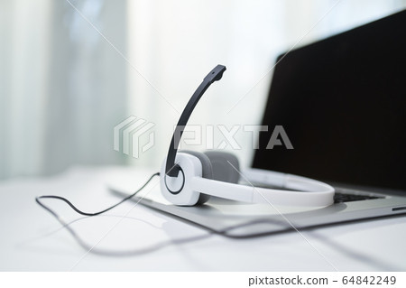 Laptop , headphones, microphone on table Laptop , headphones, microphone on table 64842249