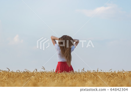 Rear view of young woman with beautiful healthy 64842304