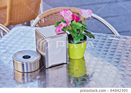 Empty table of street cafe during quarantine coronavirus pandemic 64842305
