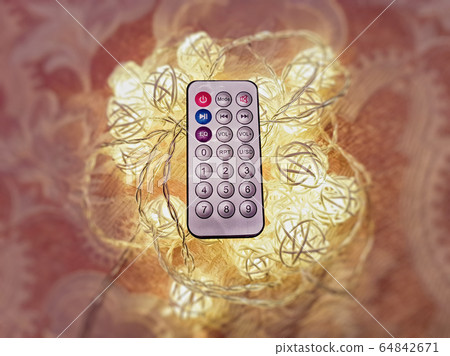 Small remote control on blurry background Small remote control on blurry background 64842671