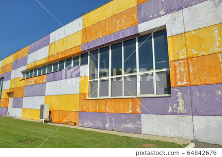 Part of the facade of an industrial building Part of the facade of an industrial building 64842676