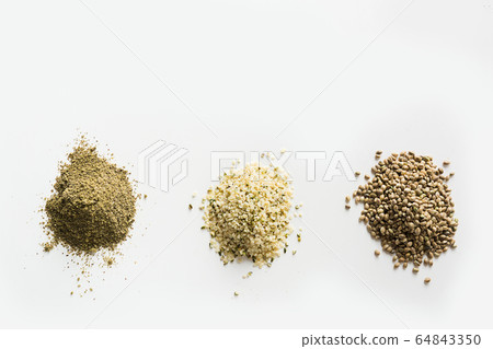 Organic dried hemp seeds, flour, kernels on white 64843350