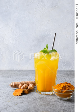 Golden milk turmeric iced latte. Ayurvedic drink Golden milk turmeric iced latte. Ayurvedic drink 64843481