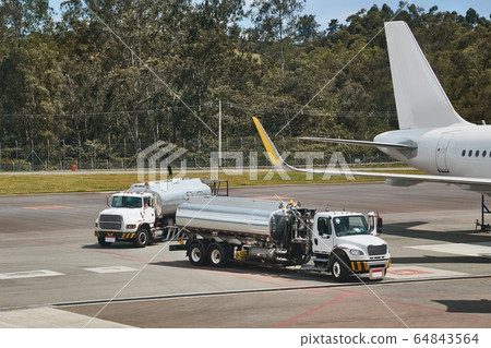 Fuel Tank Trucks at an airport Fuel Tank Trucks at an airport 64843564