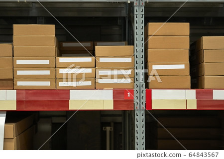 Warehouse stocked with boxes in stacks 64843567