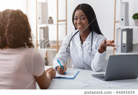 Professional dietologist consulting young woman at clinic Professional dietologist consulting young woman at clinic 64843834