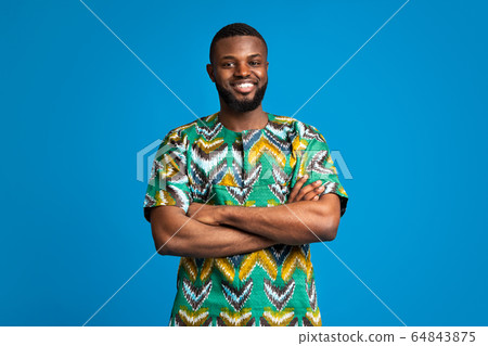 African man with traditional clothes and crossed arms 64843875