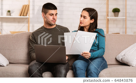 Couple having financial problems, managing family budget 64843876