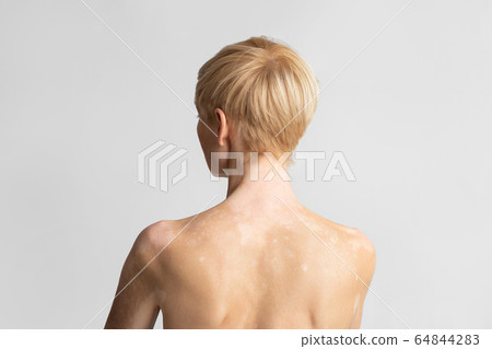 Portrait of european woman posing naked, back 64844283