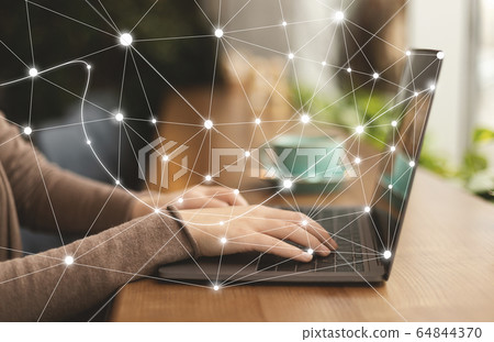 Woman using personal computer with flying network Woman using personal computer with flying network 64844370