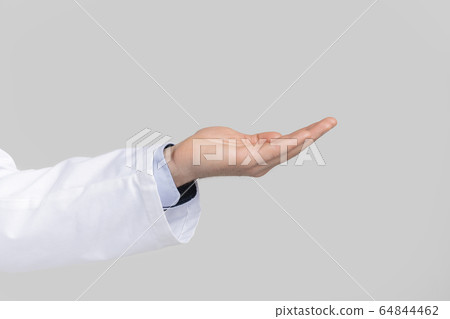 Male doctor's hand ponting or holding virtual object on open palm Male doctor's hand ponting or holding virtual object on open palm 64844462