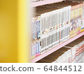 Comic books in bookshelf for background 64844512