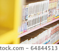 Comic books in bookshelf for background 64844513