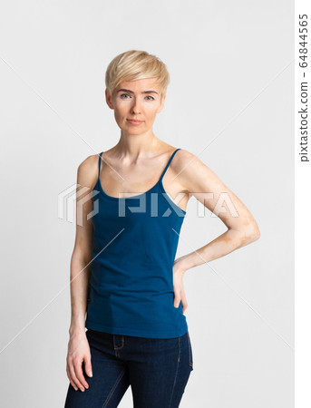 Slender woman with violation of skin pigmentation Slender woman with violation of skin pigmentation 64844565