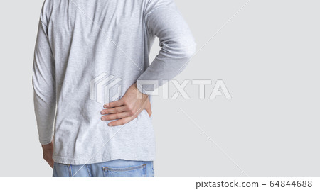 Muscle spasm, rheumatism. Man holds to his back with hand Muscle spasm, rheumatism. Man holds to his back with hand 64844688