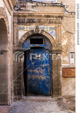 Traditional gate with an arc, Essaouira, Morocco Traditional gate with an arc, Essaouira, Morocco 64845920
