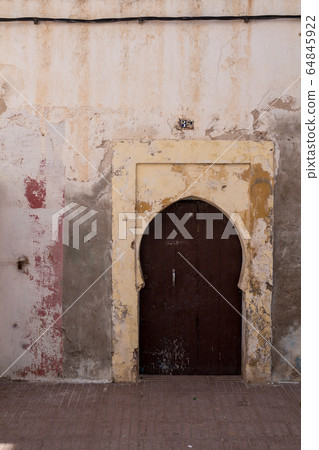 Traditional gate with an arc, Essaouira, Morocco Traditional gate with an arc, Essaouira, Morocco 64845922