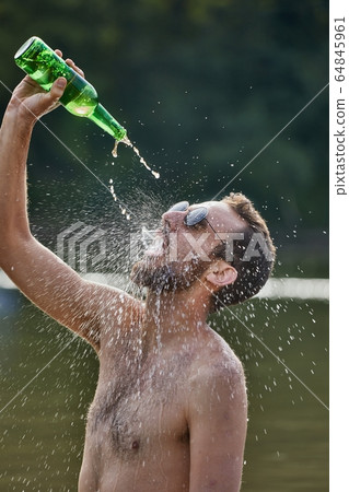 Man drinking like crazy 64845961