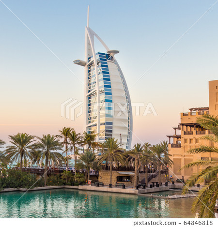 Dubai landmark, seven star luxury hotel Burj Al Arab at dusk, UAE 64846818