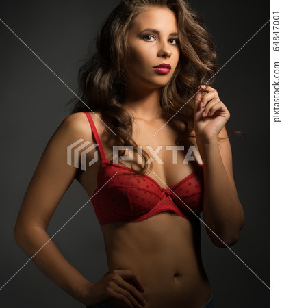 Portrait of beautiful young model dressed in bra 64847001