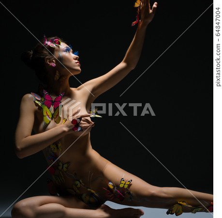Nude. Model posing with butterflies on her body Nude. Model posing with butterflies on her body 64847004