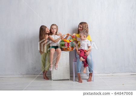 three girls and a boy ripe vegetables and fruits three girls and a boy ripe vegetables and fruits 64847008