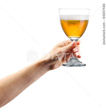 Woman hand holding glass of lager beer isolated on Woman hand holding glass of lager beer isolated on 64847488