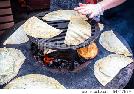 Cooking appetizing traditional uzbek pies Cooking appetizing traditional uzbek pies 64847659