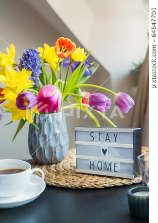 Cozy composition of cup of tea, lightbox with Stay Cozy composition of cup of tea, lightbox with Stay 64847701