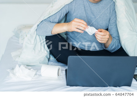 No face caucasian sick man holding used napkin No face caucasian sick man holding used napkin 64847704