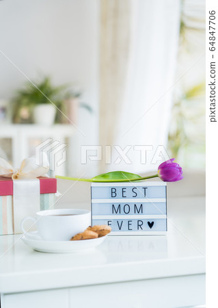 Mother's day background. Morning suprise - cup of 64847706