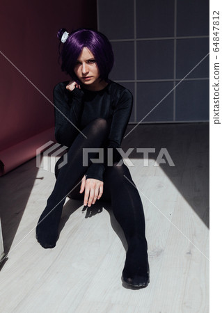 Woman anime cosplayer with purple hair Japan cartoon Woman anime cosplayer with purple hair Japan cartoon 64847812