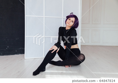 Woman anime cosplayer with purple hair Japan cartoon Woman anime cosplayer with purple hair Japan cartoon 64847814