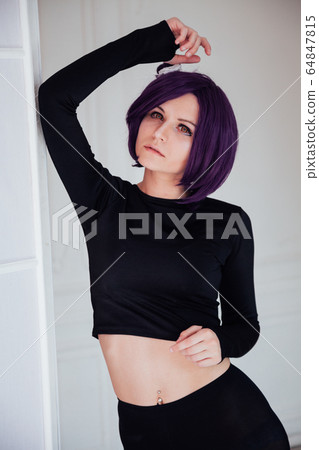 Woman anime cosplayer with purple hair Japan cartoon Woman anime cosplayer with purple hair Japan cartoon 64847815