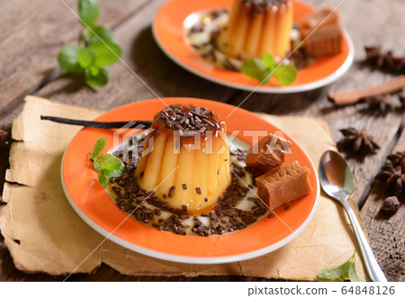 Panna cotta with caramel suce and chocolate flakes Panna cotta with caramel suce and chocolate flakes 64848126