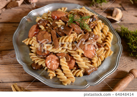 Fussili pasta with mushrooms and sausage Fussili pasta with mushrooms and sausage 64848414