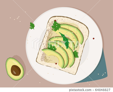 Fresh toasted bread with slices of ripe avocado. 64848827