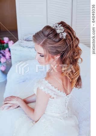 spin the bride in a wedding dress in a white room spin the bride in a wedding dress in a white room 64849336
