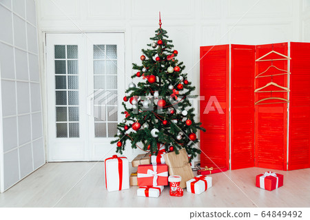 Christmas white room interior with gifts for the new year as a background 64849492