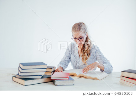 business girl Secretary reads books is preparing for the exam 64850103