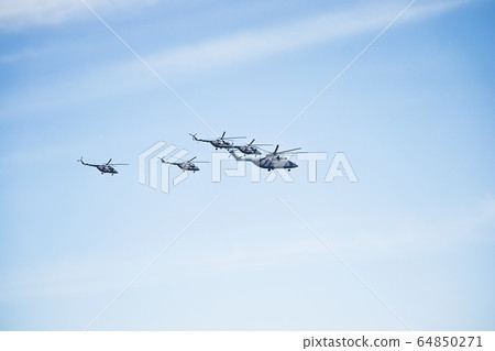 Fighters, flying helicopters at The Victory Day military parade. Fighters, flying helicopters at The Victory Day military parade. 64850271