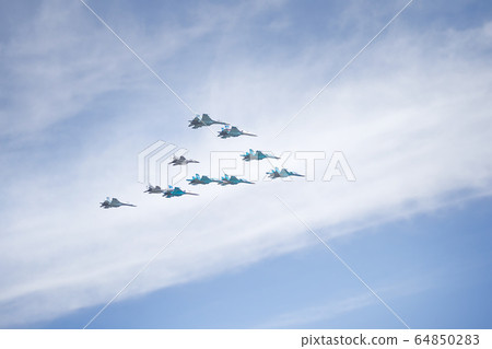 Russian aerobatic performance demonstrator team Swifts in the sky. 64850283
