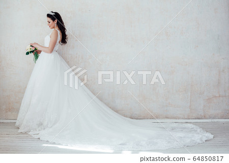 Portrait of bride wedding dress Crown curls hairstyle 64850817